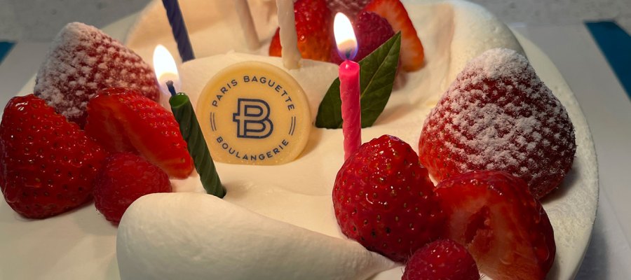 Birthday cake with candles and strawberries
